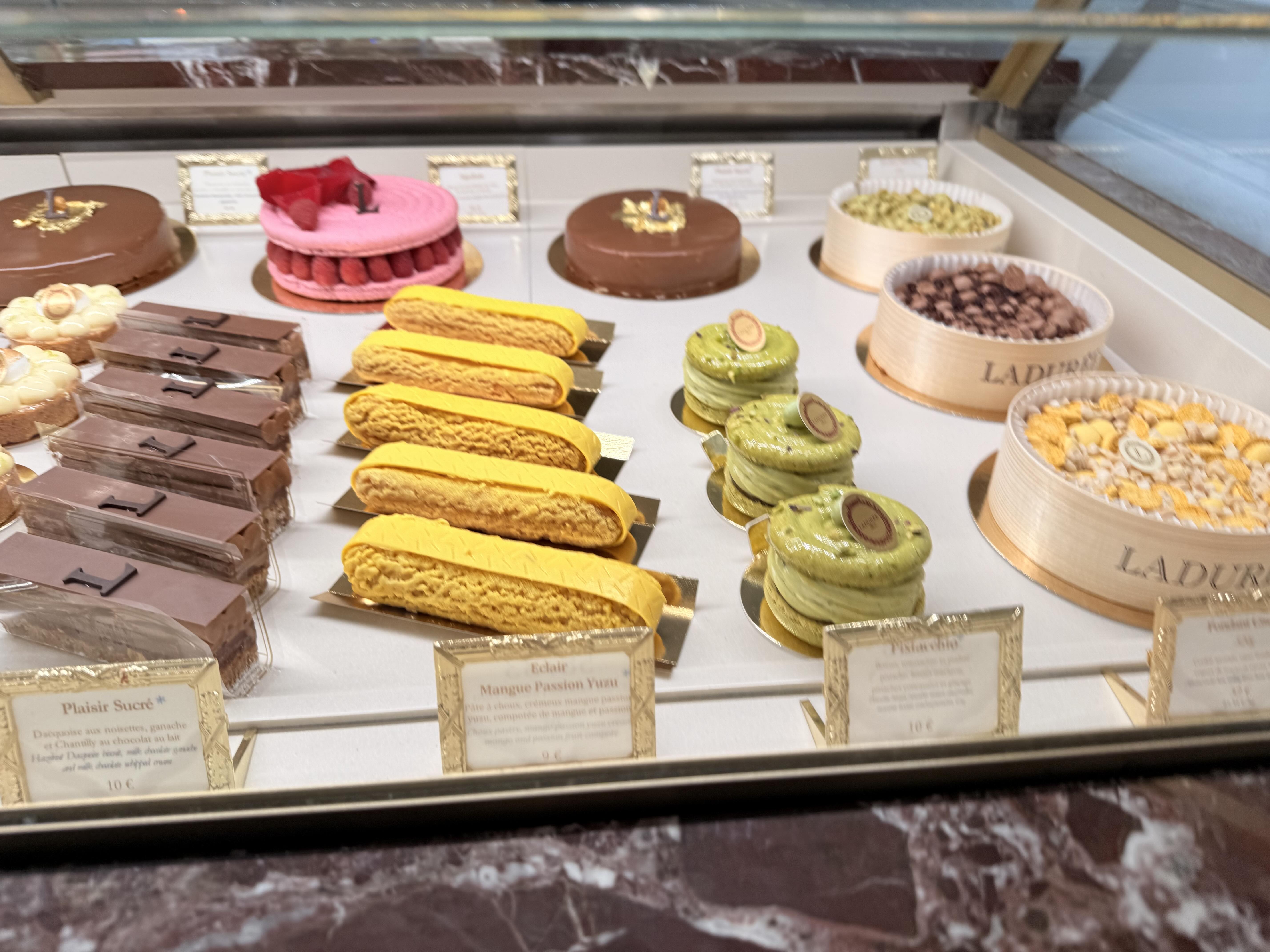 The pastel and gilded storefront of Ladurée in Le Marais